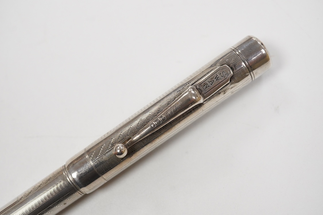 A Mabie Todd & Co. Swan Sterling silver twist filler, Made in England with 14ct. gold nib